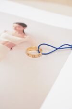 Close-up view of a Cartier ring on a hand