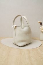 Hermès Picotin Lock 18 bag in Nata Clemence leather with gold hardware and ostrich leather handle