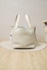 Hermès Picotin Lock 18 handbag in Nata Clemence leather with gold hardware and ostrich leather handle